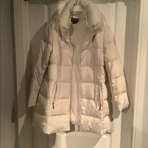 Cream coloured women’s winter down jacket